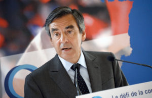 Francois Fillon, former French prime minister and interim co-president part of a triumvirate of the French right-wing opposition UMP party, speaks during a press conference on the theme "Reconnecting with competitiveness" on June 25, 2014 in Paris. AFP PHOTO/BERTRAND GUAY